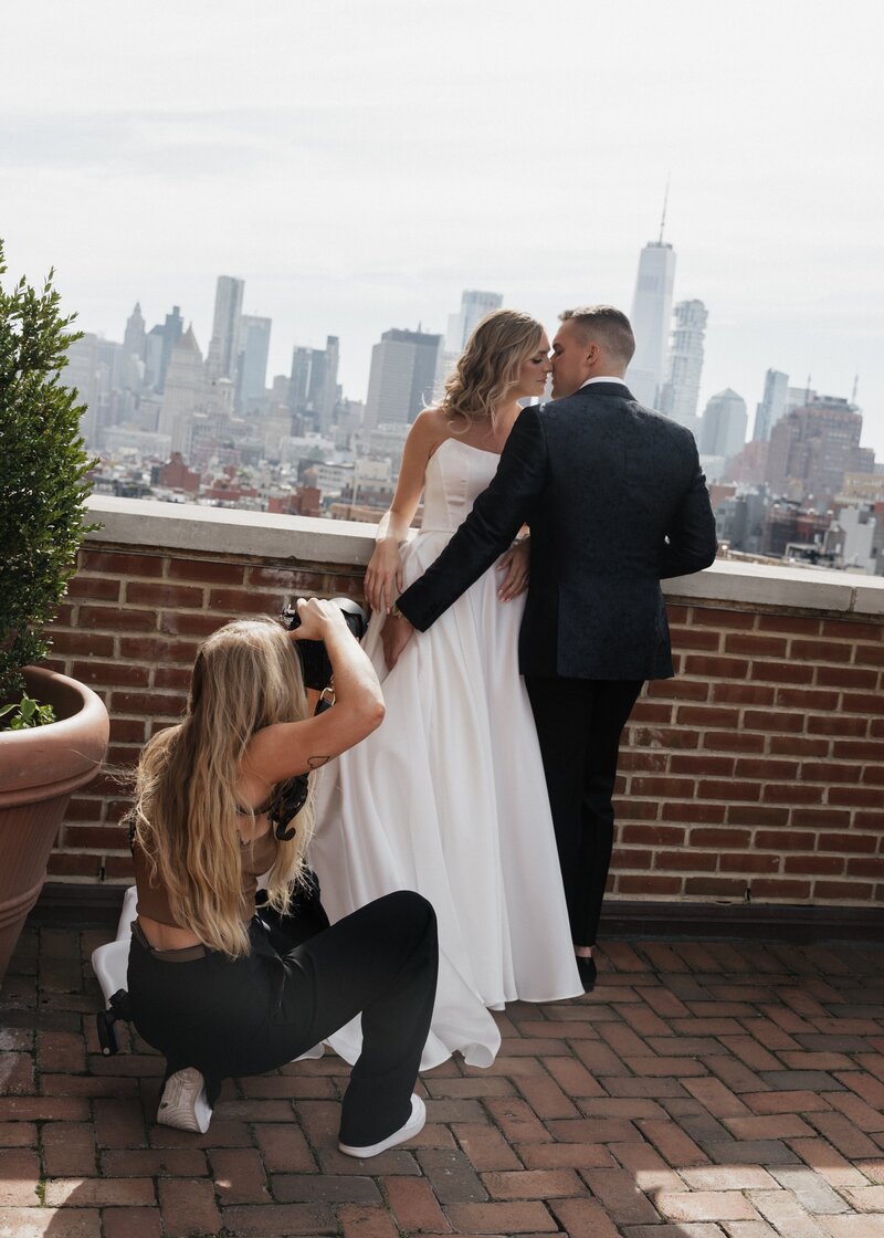 Kyla taking timeless pictures of a newly married couple