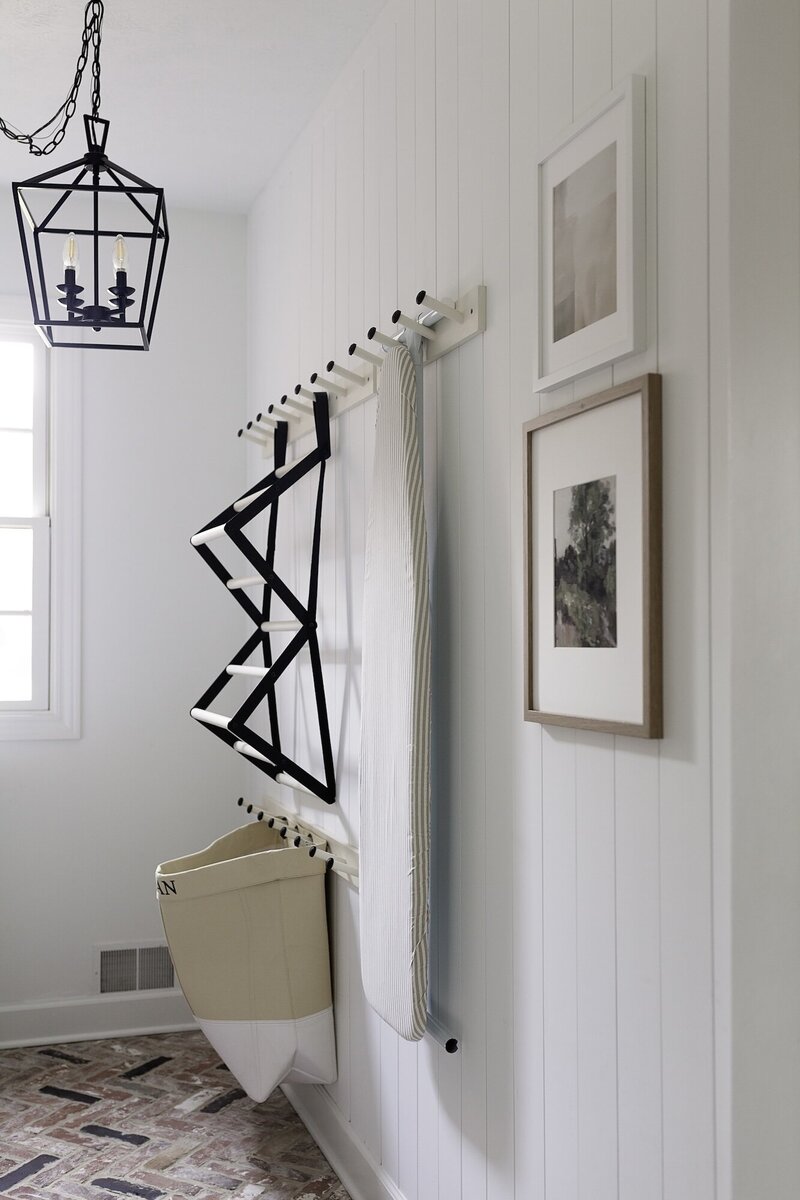 Pantry wall with boots hanging from pegs