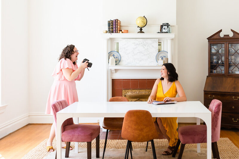 Picture of a nashville brand photographer working with a client at an airbnb