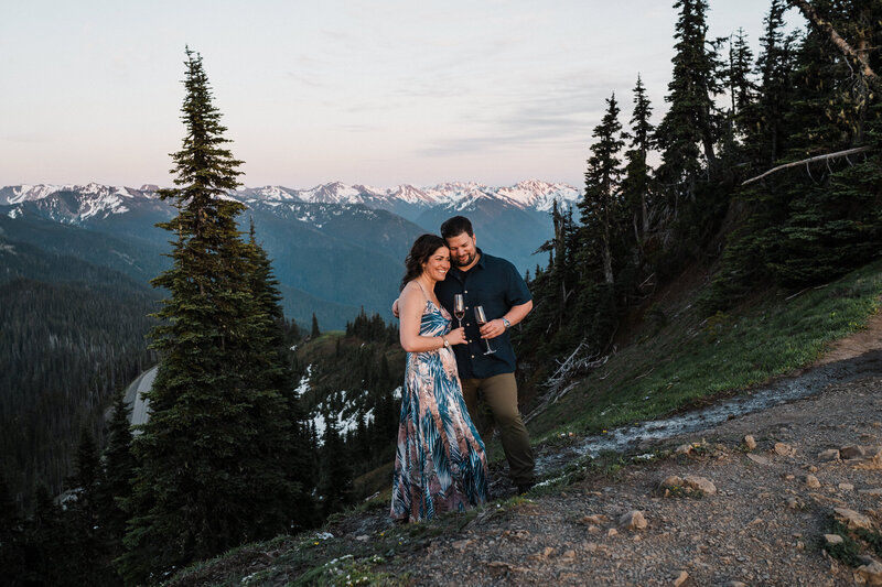 A bride and groom laugh together on a beach on Camano Island after their elopement