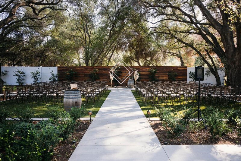 wedding ceremony set up with geometric ceremony centerpiece at the oaks at Duncan lane, San Diego