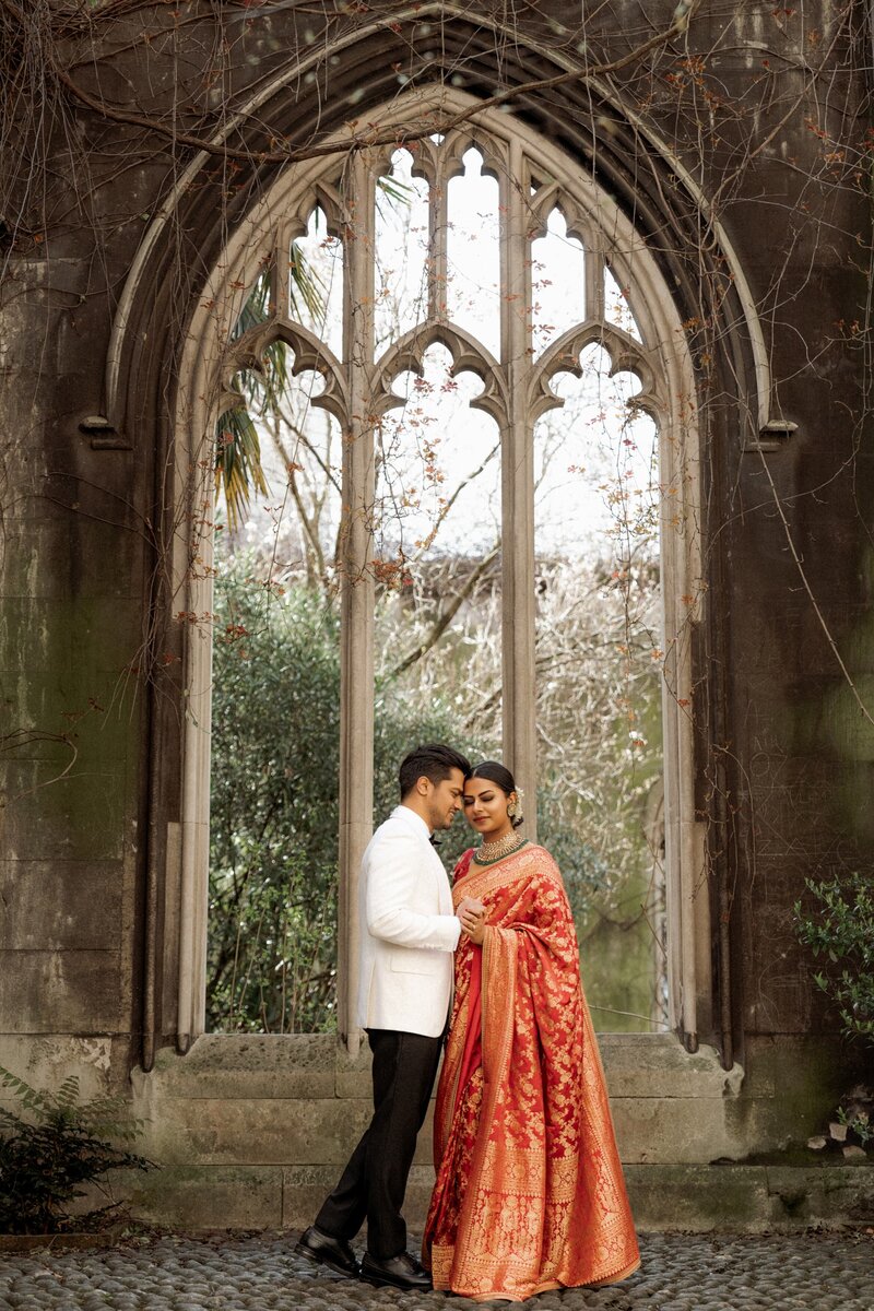 cute-couple-cuddling-during-London-wedding-photography-at-st-dunstan-in-the-east-garden-00298