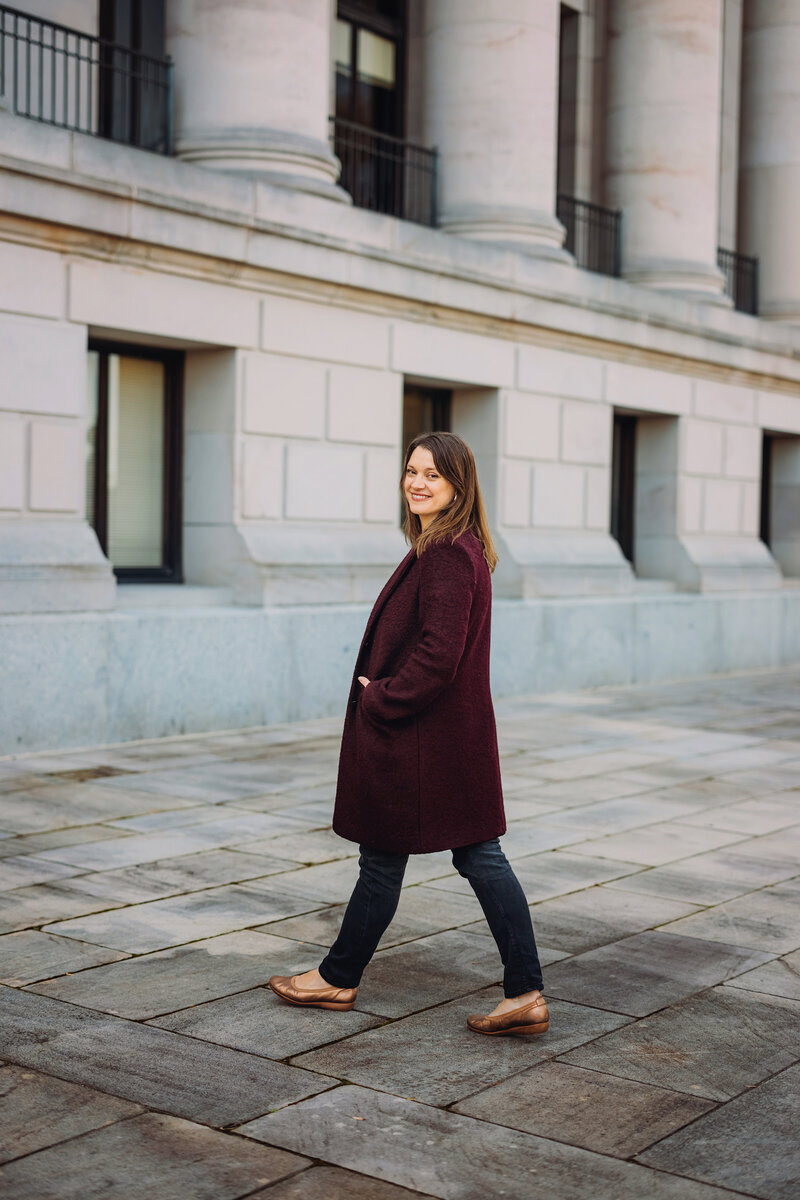 Realtor Jessie Henneck-Aguiar walking across the chamber yard