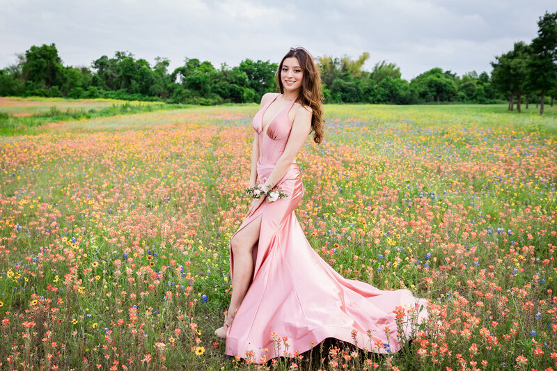 senior girl posing in her prom dress