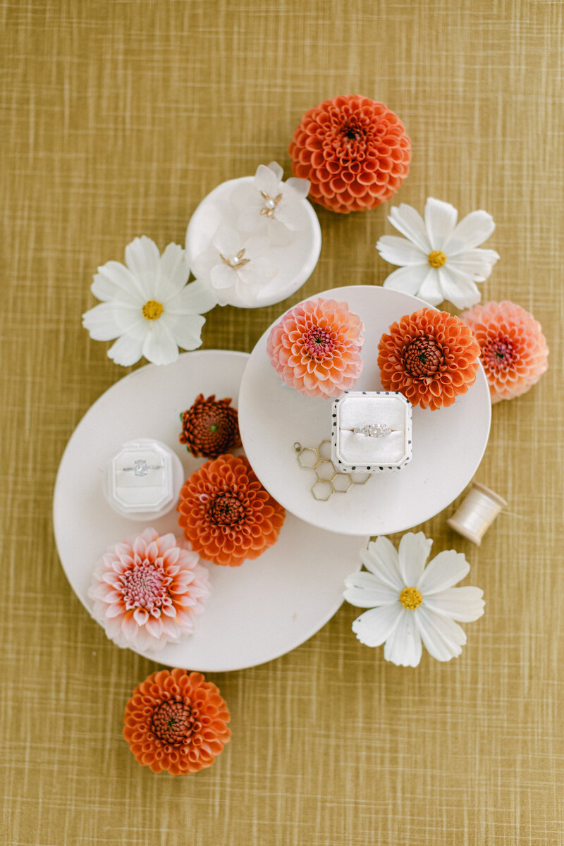 Velvety yellow flat lay mat styled with bold florals and bridal details