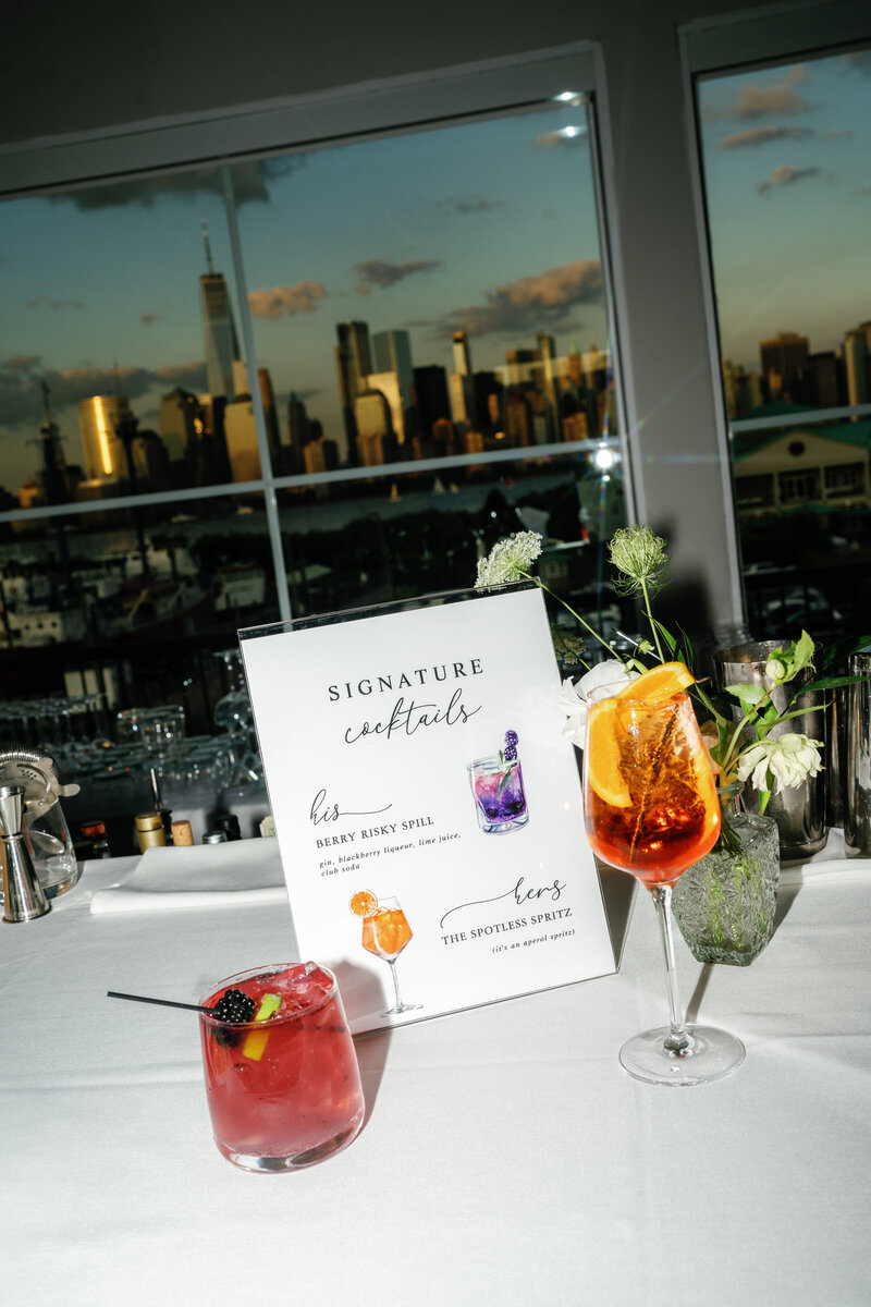 Direct Flash photograph of a wedding couple's signature drinks with the NYC Skyline in the background at Maritime Parc Wedding Venue