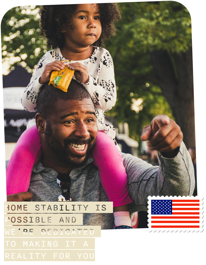 man with little girl on his shoulders smiling and pointing