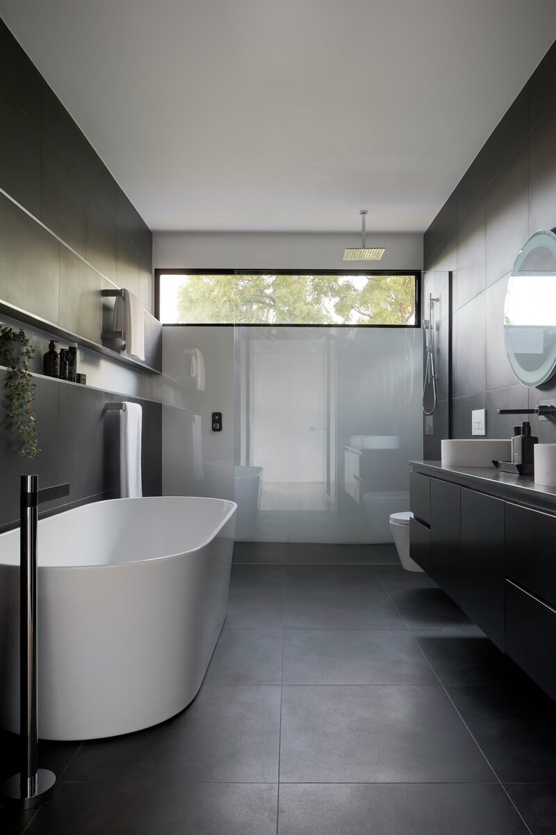 architecturally designed bathroom with black and white modern aesthetic