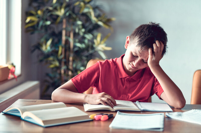 student struggling to complete his math homework