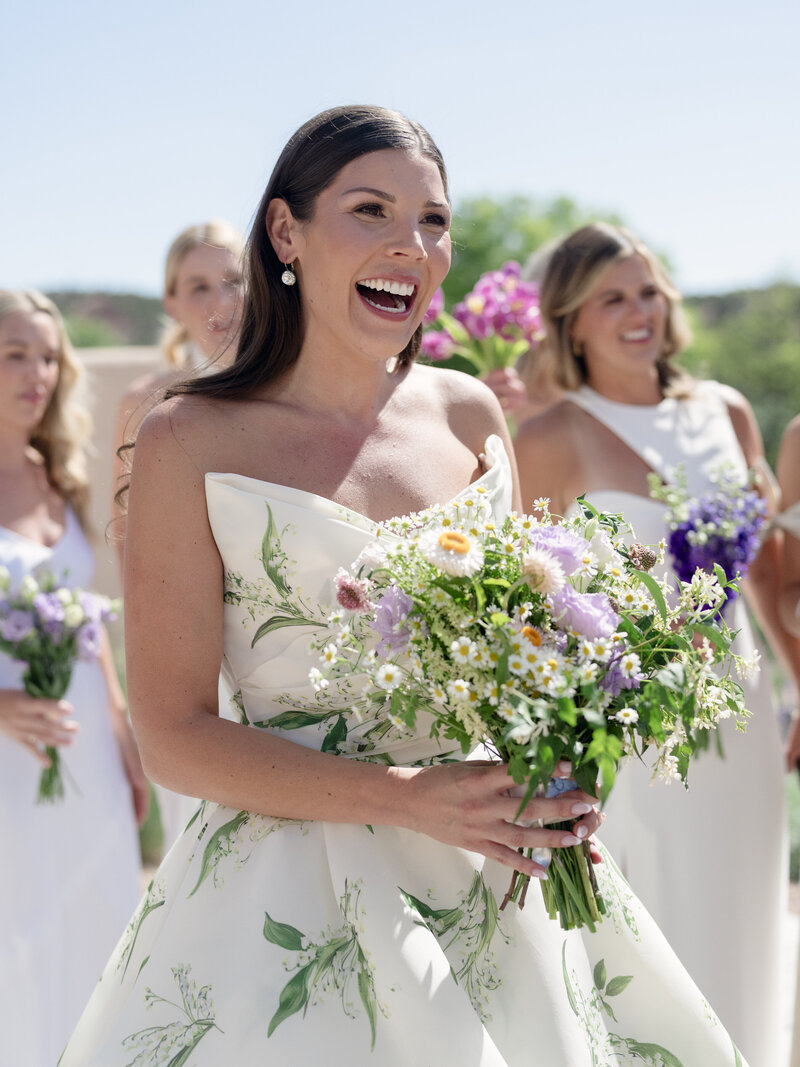 woman poolside smiling with sunglasses