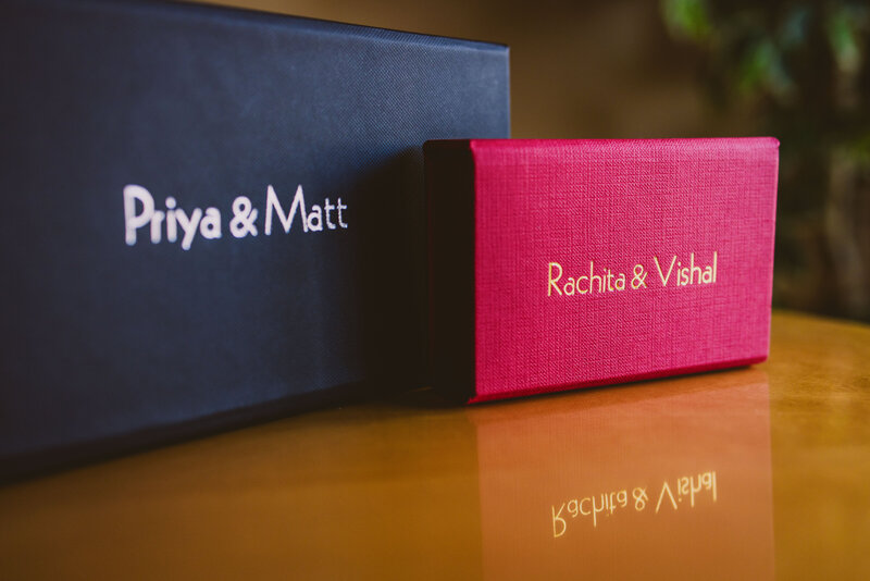 Customized usb flash drive cases with the bride and groom's names foil stamped on the front