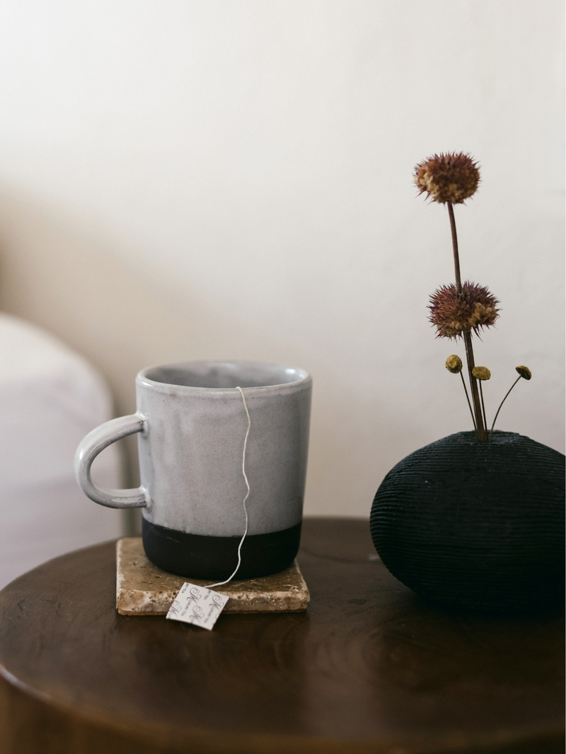 Taking a sip of MŪZ Tea