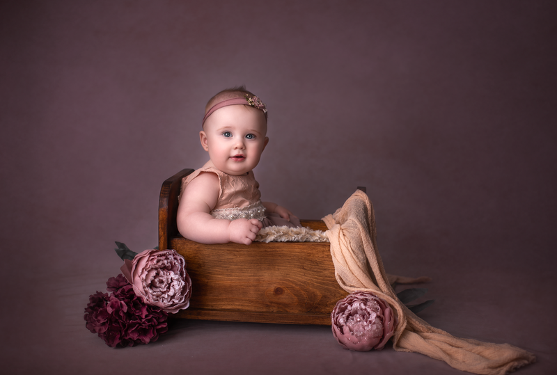 "6-month-old baby captured in a milestone photography session, showcasing their adorable personality and growth in Ottawa."