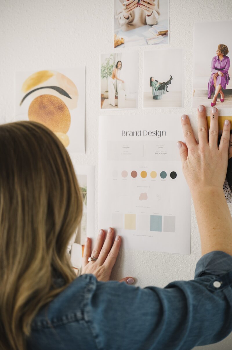 Krista Marie, a brand photographer for women, putting up brand photos of women during her brand photoshoot