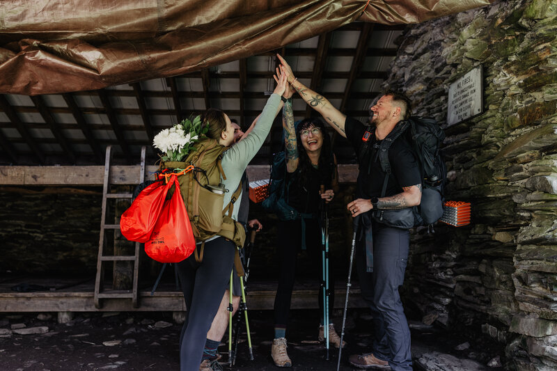 Adventure elopement photographers plan backpacking experience in backcountry shelter at Mount LeConte in the Smoky Mountains.