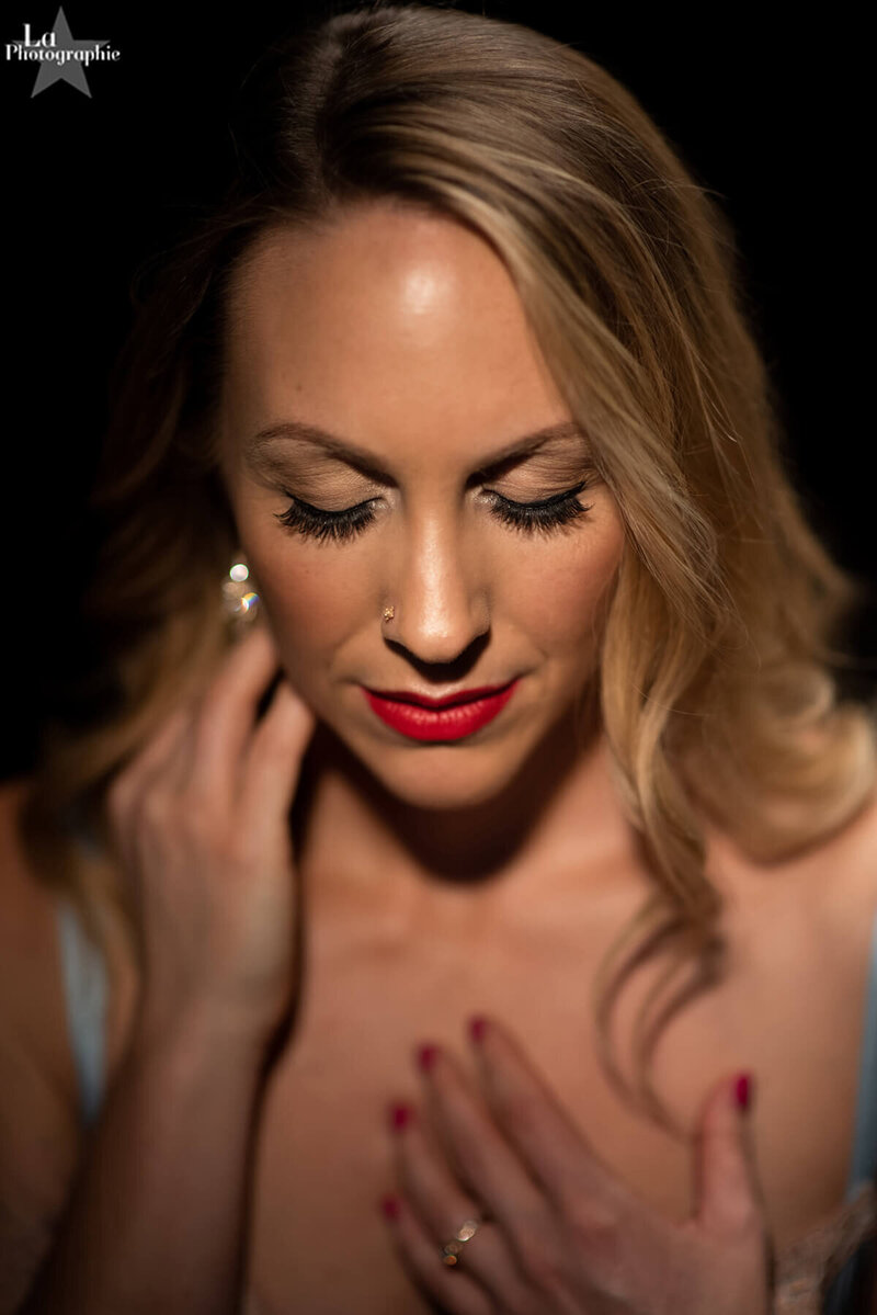 Cherish, founder and guide of Sacred Sequin, in intimate portrait with eyes closed