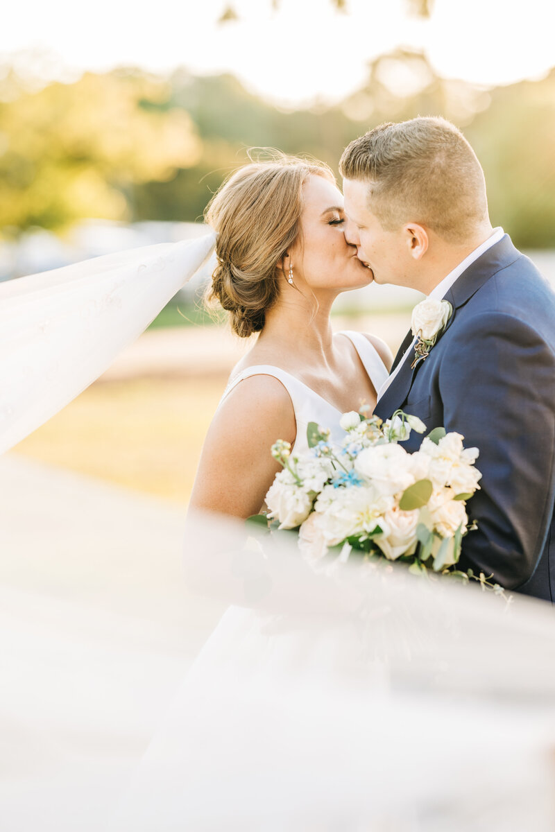 Bride and groom sharing an intimate embrace, celebrating their love on their wedding day. A timeless moment filled with elegance and deep connection