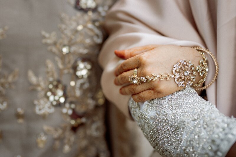 Bride holding groom hand during their wedding photography