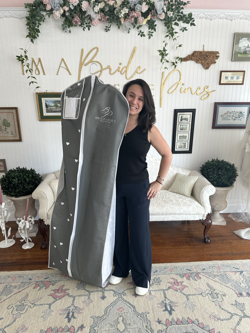 bride with her wedding dress taking it home from bride of the pines