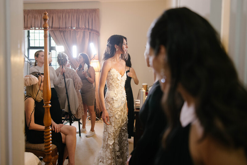 bride and bridesmaids throwing confetti