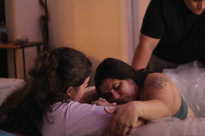 Doula Supporting Mother Through Natural Home Birth