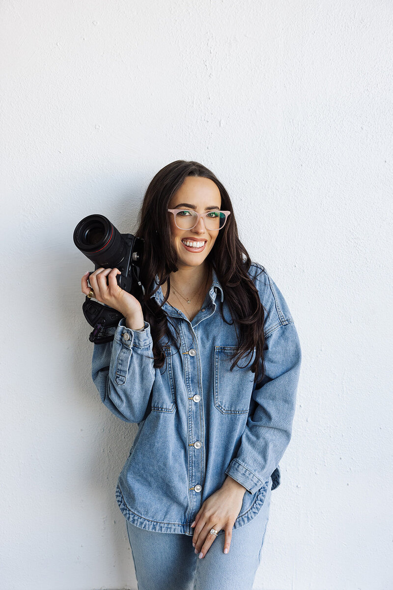 Photographer branding shoot holding camera