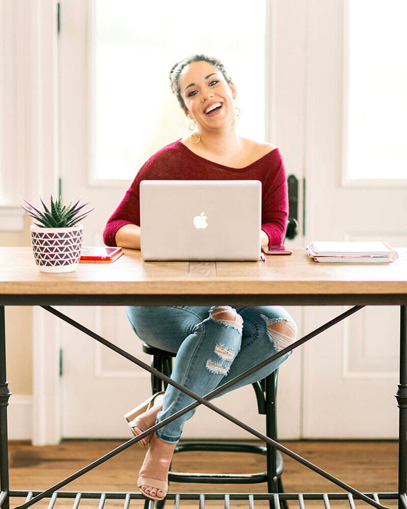woman smiling at desk