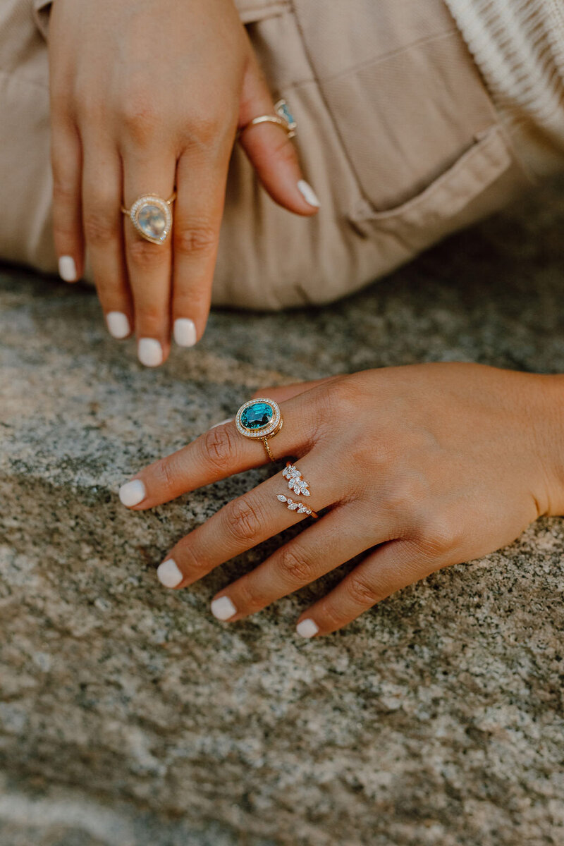 Bezel set blue zircon ring with natural diamond halo