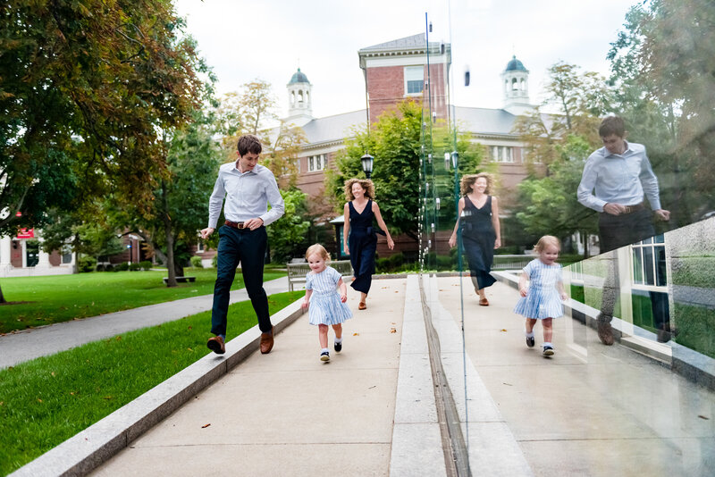 reflection photo of a family running in Harvard