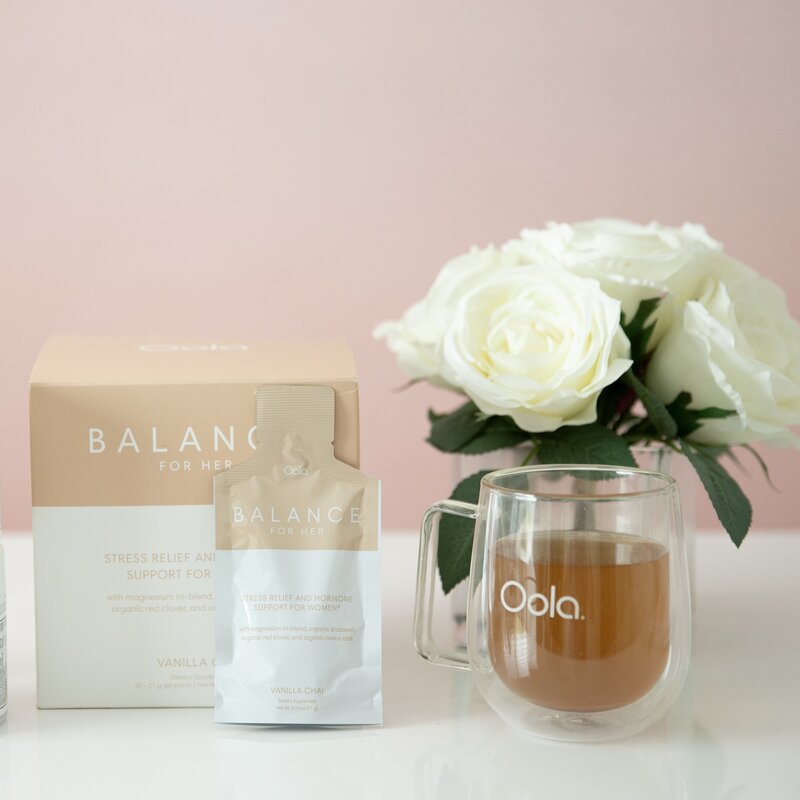 oola balance supplement with tea and whte flowers