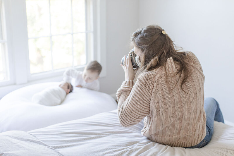 photographer taking pictures of baby