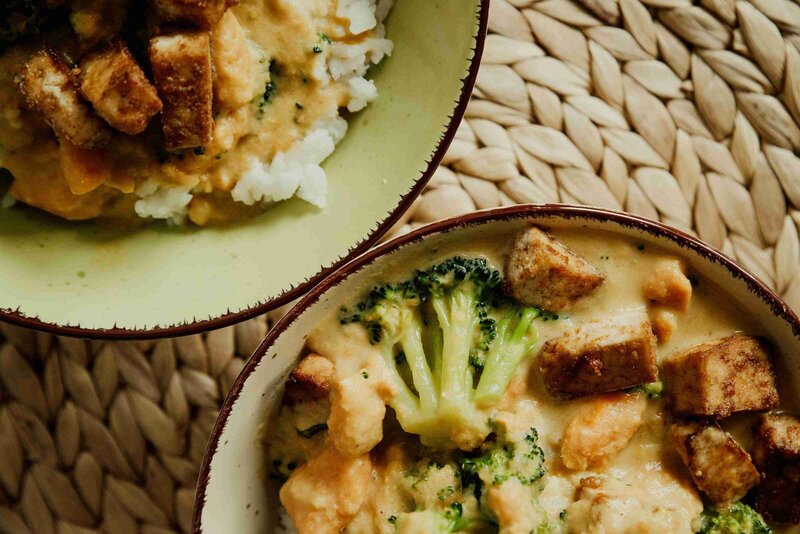 Two bowls of food featuring broccoli and chicken, highlighting a balanced meal option.