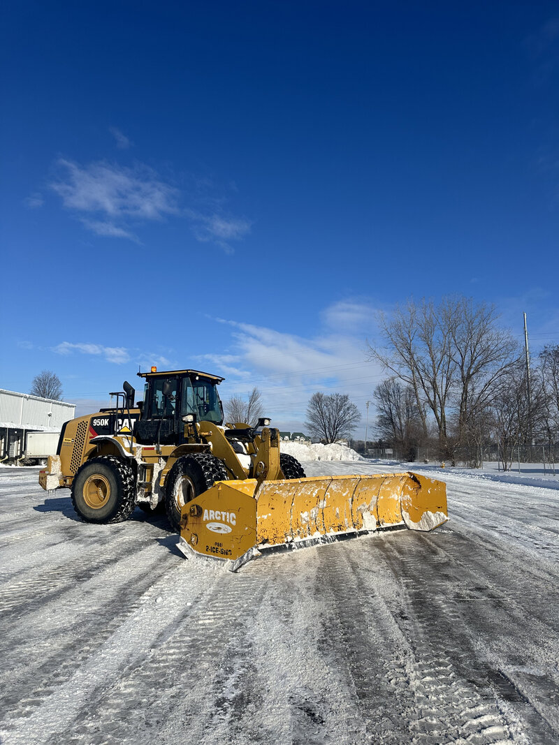 Removing snow and ice from commercial lot