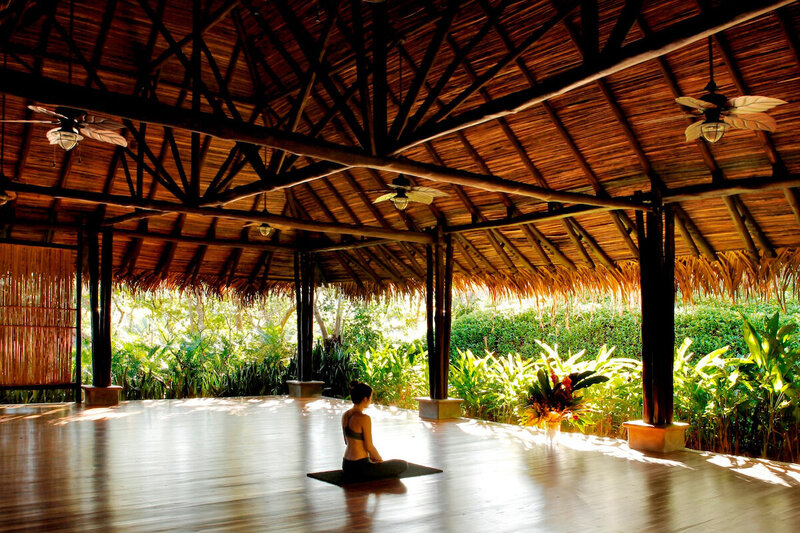 person sitting in nature studio yoga blue spirit costa rica