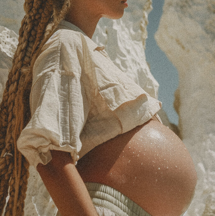 Side profile of a pregnant person showing their belly