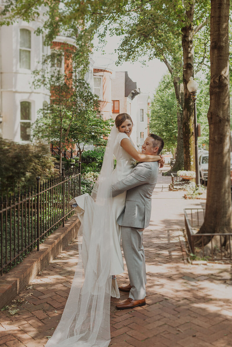 Groom Lifts Bride on Streets of DC