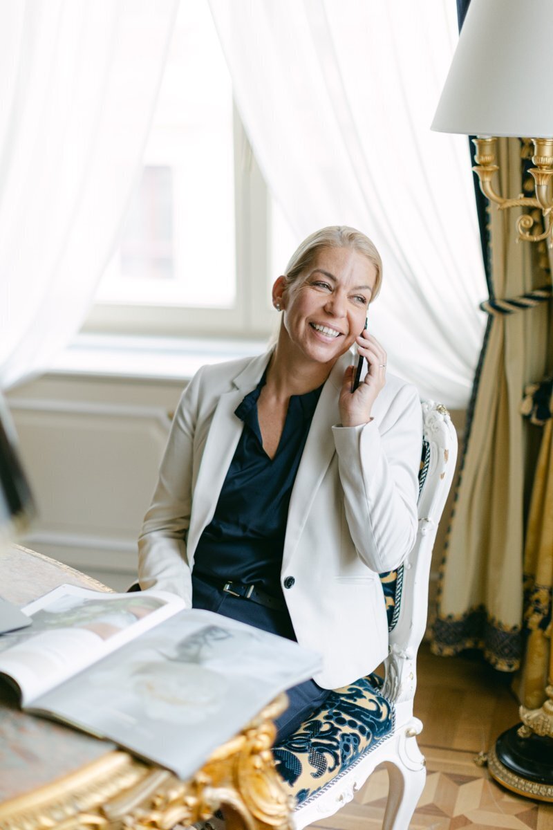 Wedding planner Michaela Grote on the phone in luxury Hotel Imperial Vienna