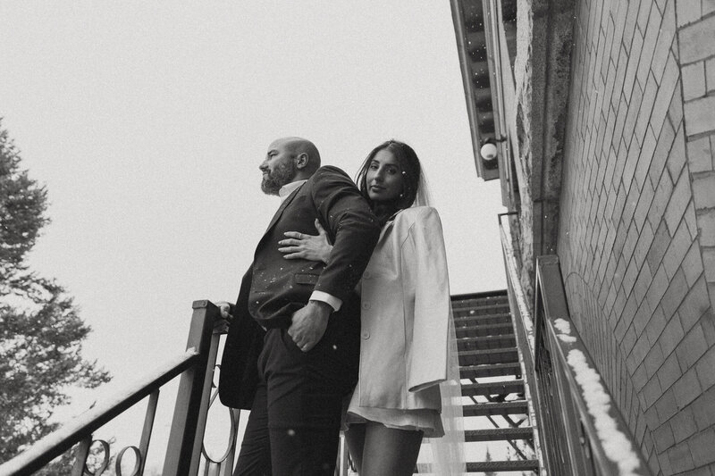 bride and groom embracing on the steps