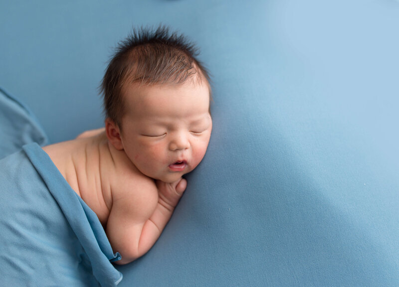 Wrapped baby boy in Blue swaddle