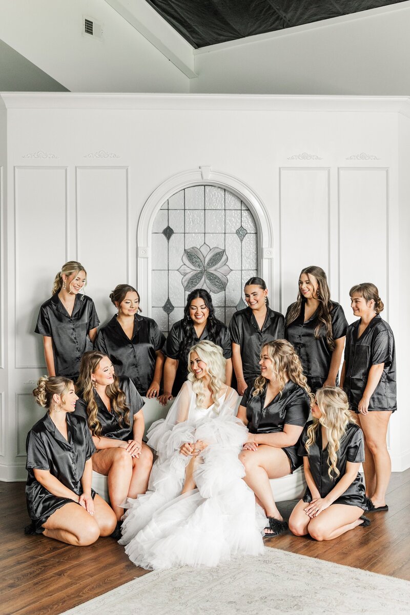 a bride sitting with her bridesmaids
