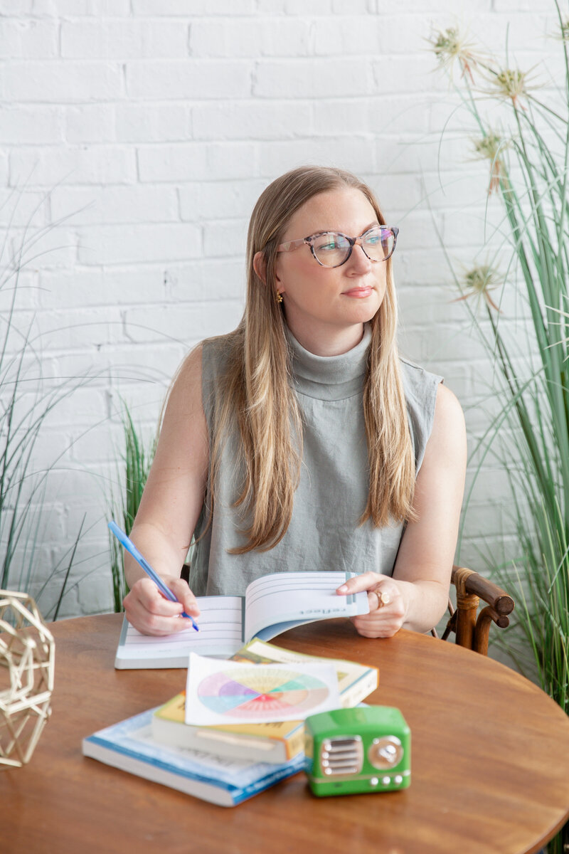 woman in glasses with blue shirt professional headshot