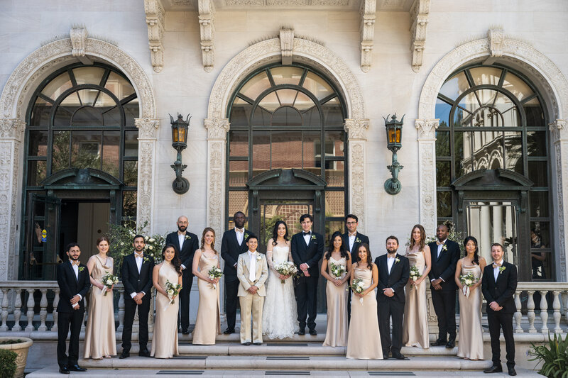 Wedding party at historic Flood Mansion with classical arched windows and Pacific Heights architecture - San Francisco wedding photographer