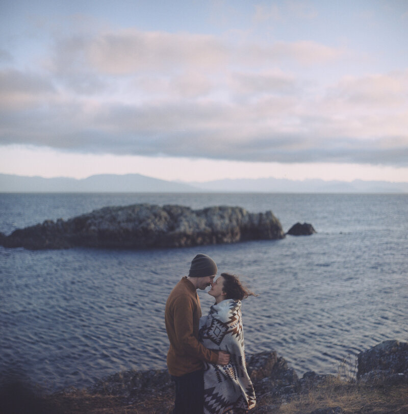 Capturing a candid moment during sunrise at a portrait session on Vancouver Island