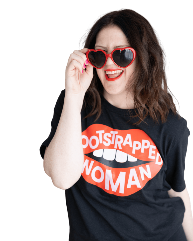 Emily, a brand and web designer for women, sports a shirt that says 'bootstrapped woman,' celebrating her entrepreneurial spirit.