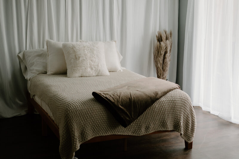 Photo of a bed in moody lifestyle studio in Annapolis Maryland