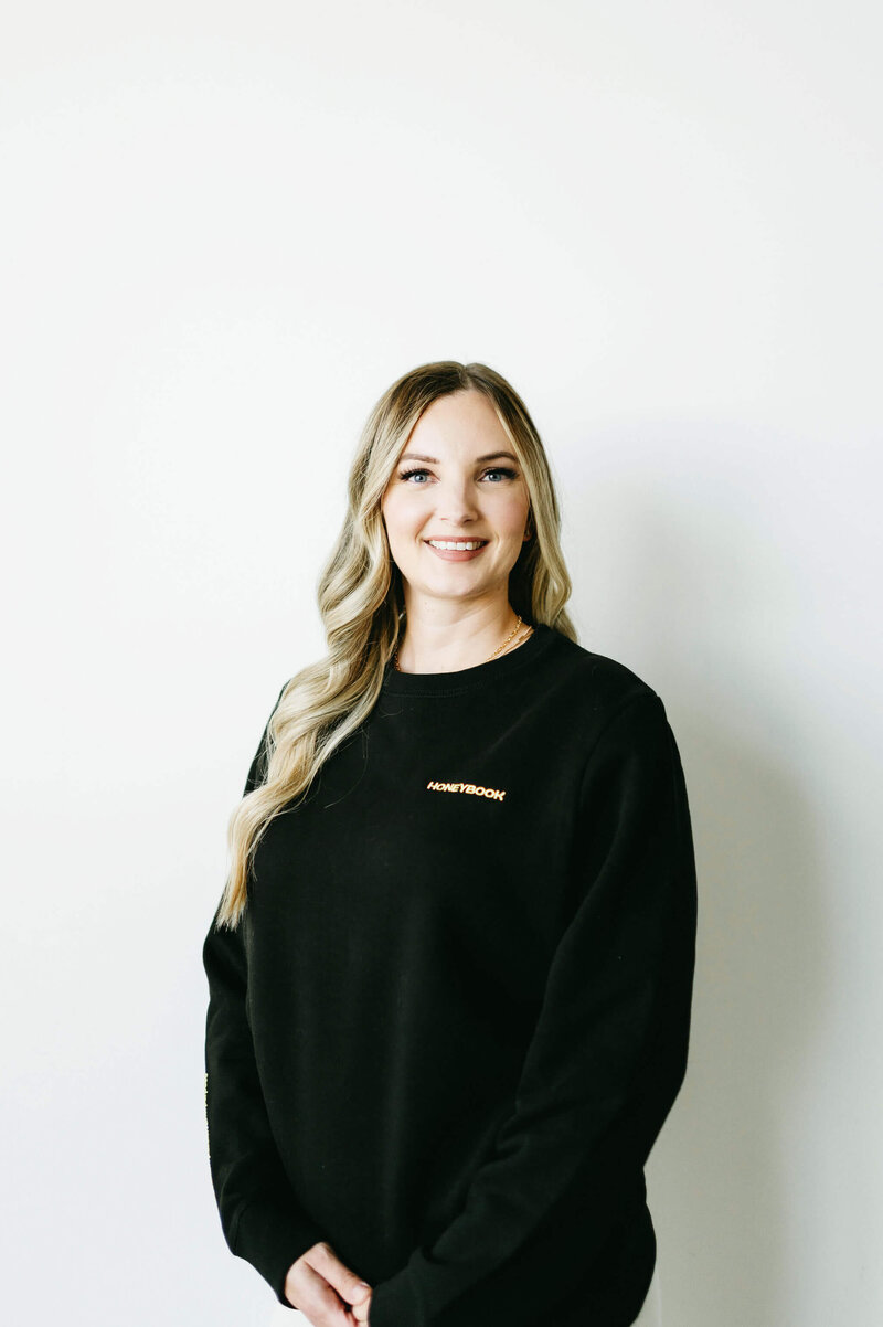 HoneyBook expert, Karly Whitaker, smiling after becoming a Certified HoneyBook Pro.