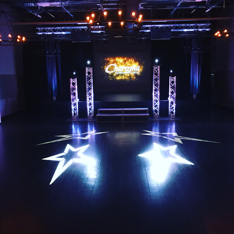 Custom AV lighting and stage design setup with Charizma logo for Chicago party or special event