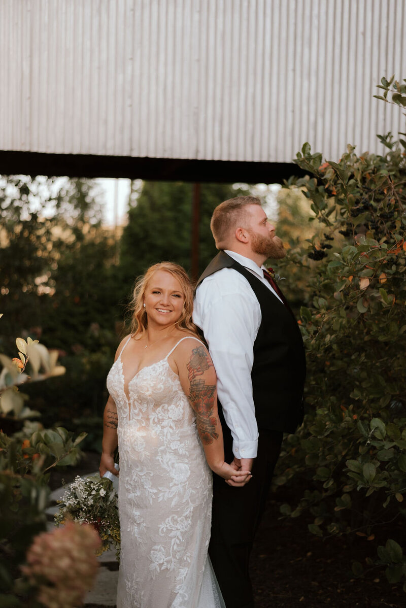bride and groom pose for portraits at wedding venue in peoria illinois
