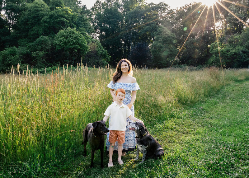 Portrait of a mother, son, and pet dogs at a Sussex County, New Jersey park.