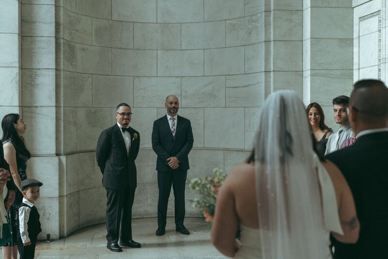 bride walking down aisle during NYPL elopement shot by Elsie Goodman Photography | NYC Elopement Packages